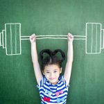 a girl carrying chalk weights